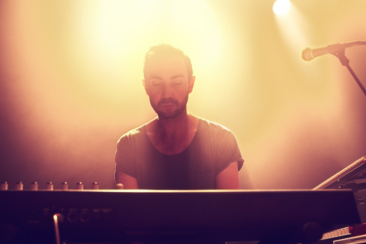 A musician playing on a keyboard at a concerthttp://195.154.178.81/DATA/i_collage/pi/shoots/782608.jpg